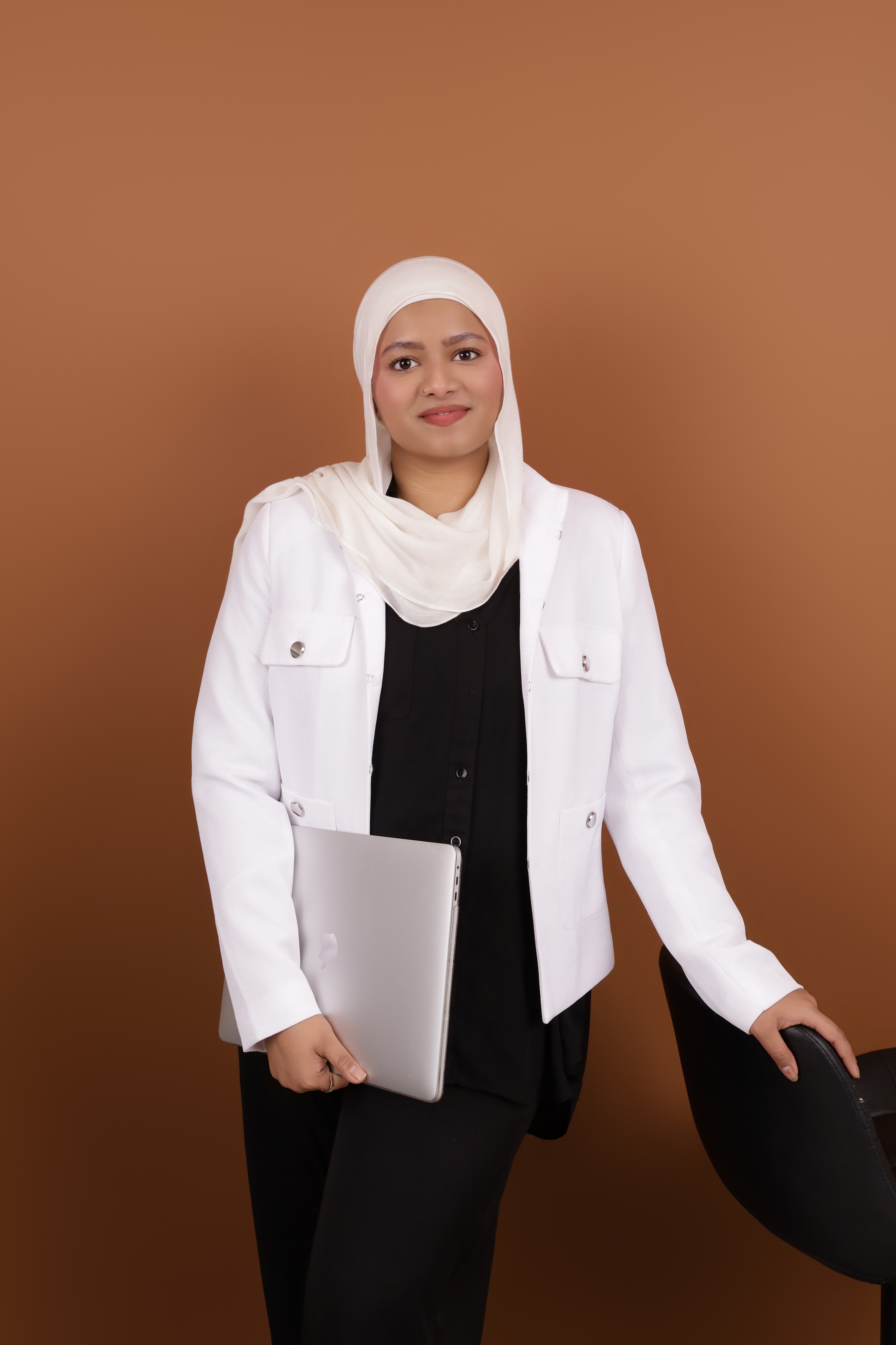 Designer portrait holding a laptop